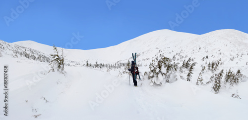 Alpine touring skier in winter mountains. © sss615