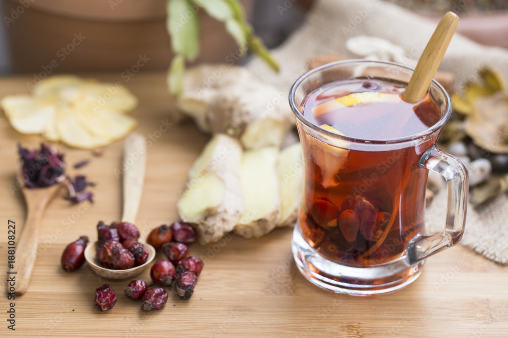 Healthy herbal tea, spiced tea over wood background Healthy herbal tea, spiced tea over wood background
