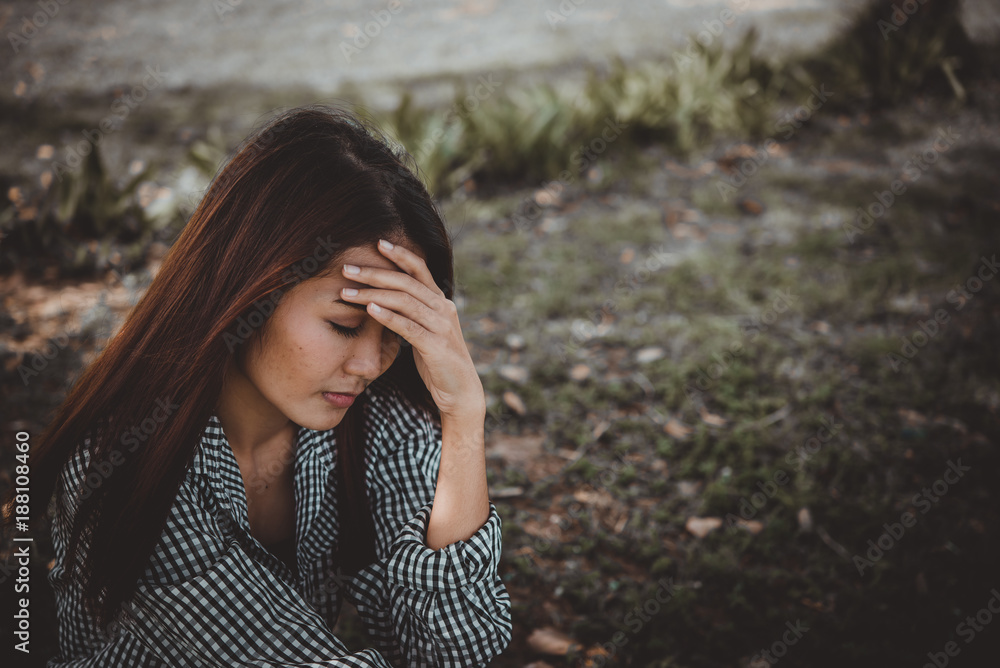 Close up asian sad woman heartbreak from From unrequited love,Brokenheart young girl concept,vintage style,dark tone Close up asian sad woman heartbreak from From unrequited love,Brokenheart young girl concept,vintage style,dark tone