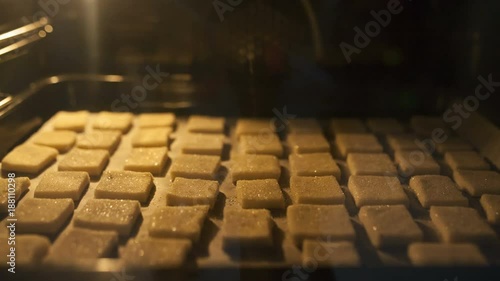 Wallpaper Mural puff pastry biscuits dusted with sugar, and laid out in rows on the sheet is raised and fried in the oven Torontodigital.ca