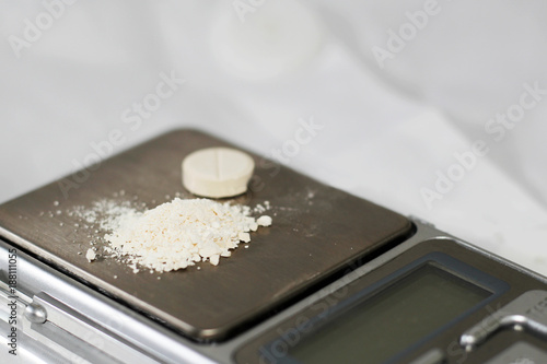Laboratory scales. Pills and medication.