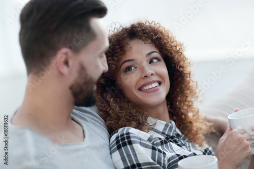 loving couple sitting on a sofa in the living room