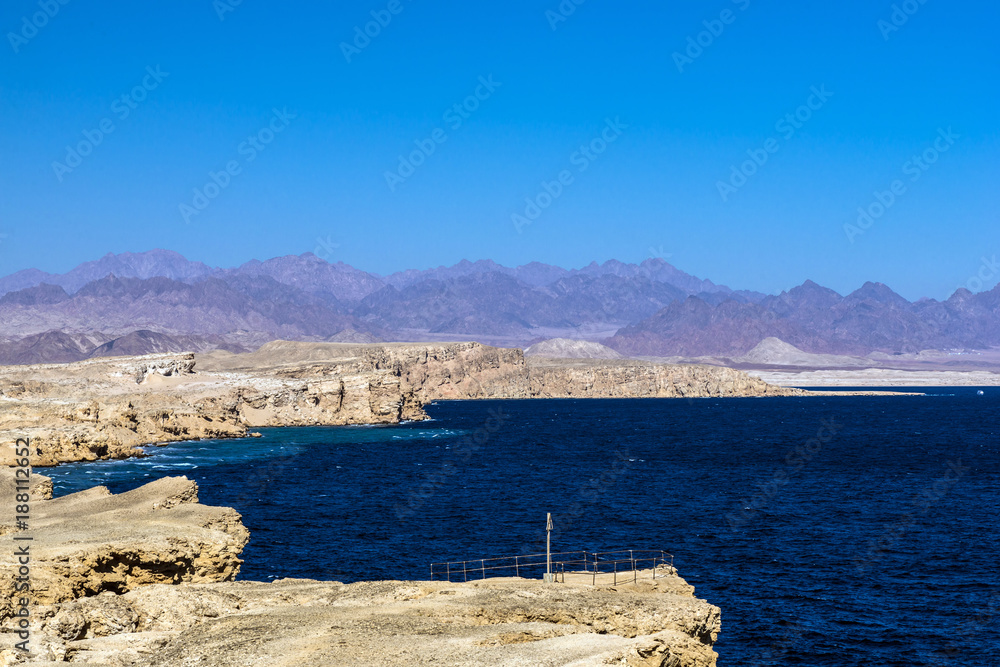 Rocky coast, Sinai mountains and the Red Sea in the Ras Muhammad National Park.
