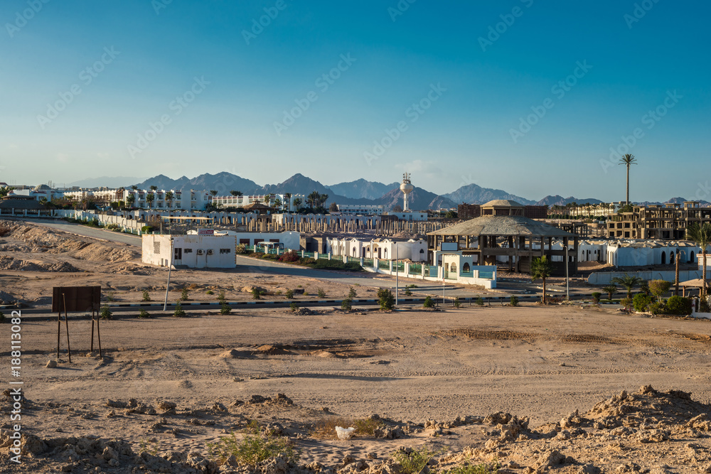 Fragment of the city of Sharm El Sheikh on the background of the Sinai mountains at sunset