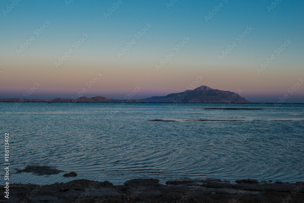 Tirant island and the Red Sea in the evening at sunset.