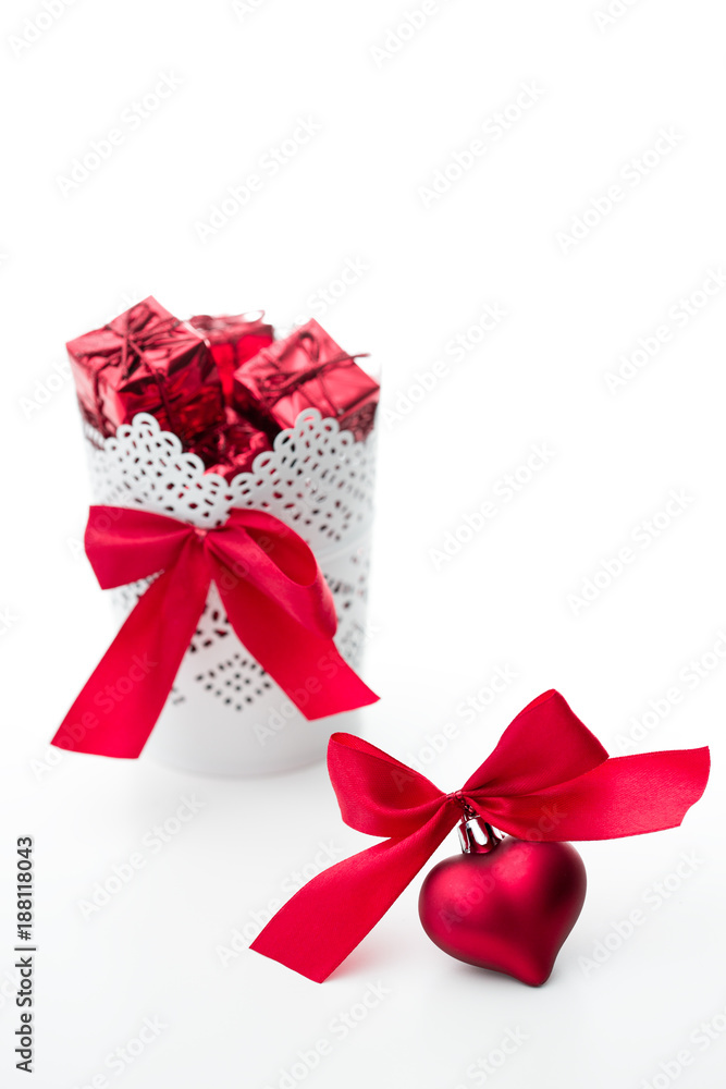 gift and heart with a bow of red color on a white background gift and heart with a bow of red color on a white background