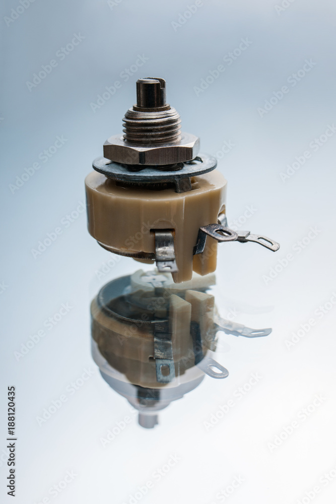 variable resistor on a white background. apparatus regulating the