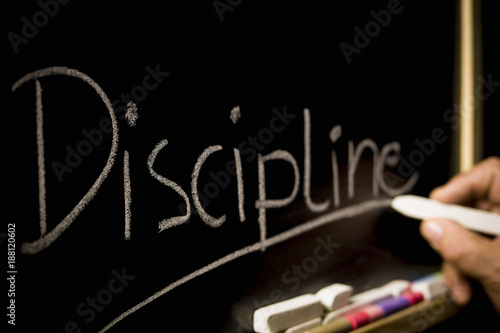 Photography The concept of discipline, the inscription on the background of the blackboard