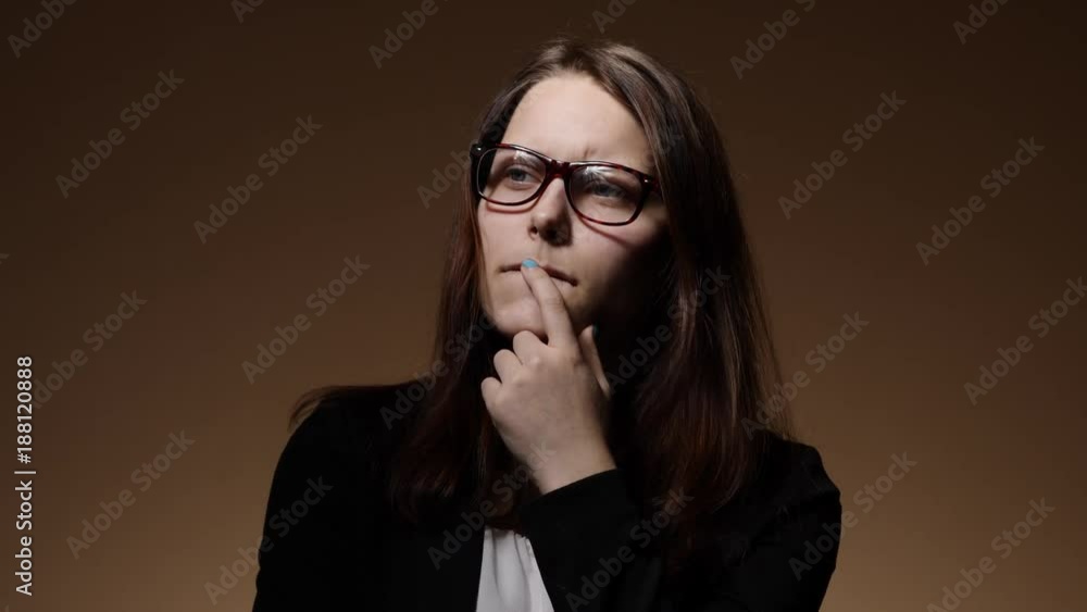 Nervous teen student girl in glasses Nervous teen student girl in glasses
