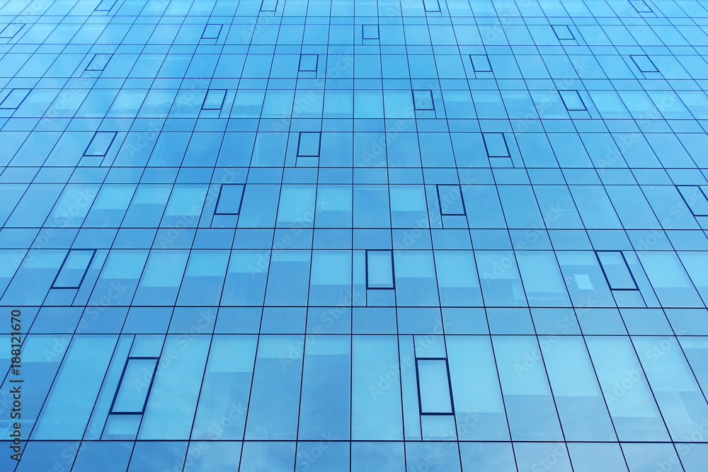 Facade of a modern office building. Modern industrial building with glass. Abstract background. Facade of a modern office building. Modern industrial building with glass. Abstract background.