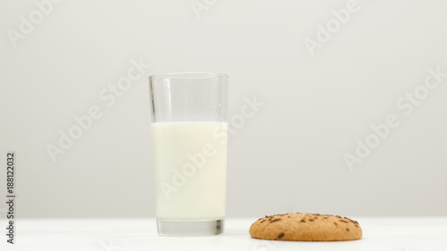 Glass of milk and oatmeal cookie - a tasty snack before going to sleep. Healthy evening food