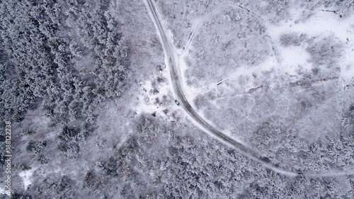 Winter Aerial Shot Of Snowy Mountain Forest  With Roads High Attitude © IM_VISUALS