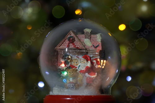 Glass snow globe with Santa Claus and lantern. Christmas toy