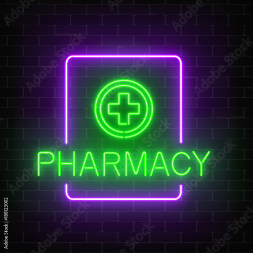 Glowing neon pharmacy signboard on a dark brick wall background. Illuminated drugstore sign with neon effect.