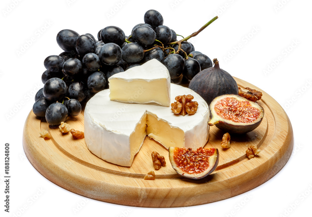 Round brie or camambert cheese on cutting board white background Round brie or camambert cheese on cutting board white background