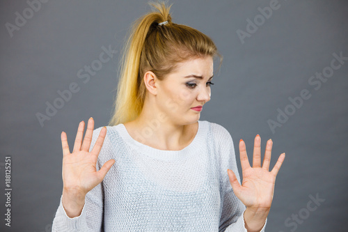 Woman deny something showing stop gesture with hands