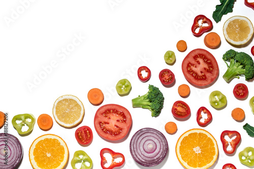 Assorted sliced vegetables and fruits on white background. Flat lay. Food vegan concept.