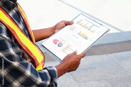 Engineer holding sheet