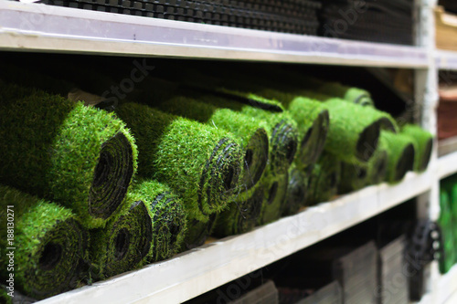 Rolls of artificial grass sale on the shelf