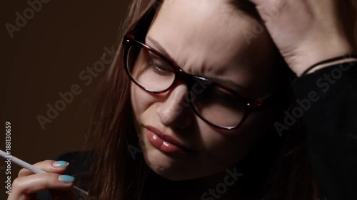 Nervous teen girl with a cigarette