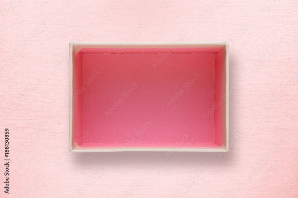 Fototapeta premium Opened box top view on pink background