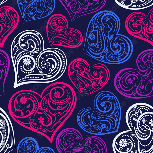Seamless pattern of big hearts with ornament of curls, flowers and leaves, colored on dark blue