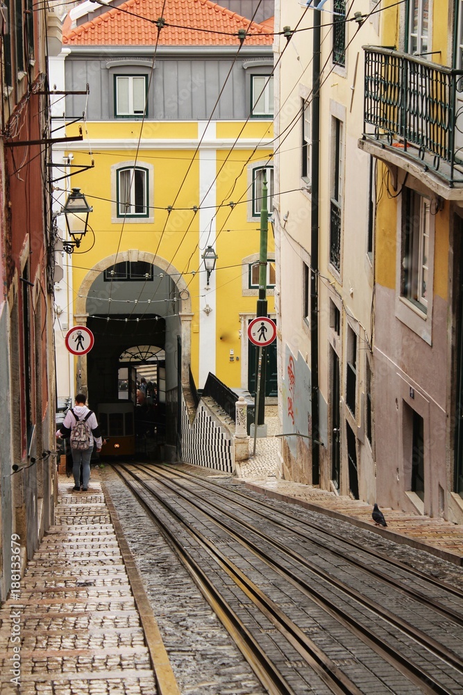 Inclined street in Lisbon and Bica Elevator rails