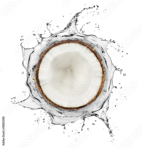 Coconut is surrounded by a splash of water on white background
