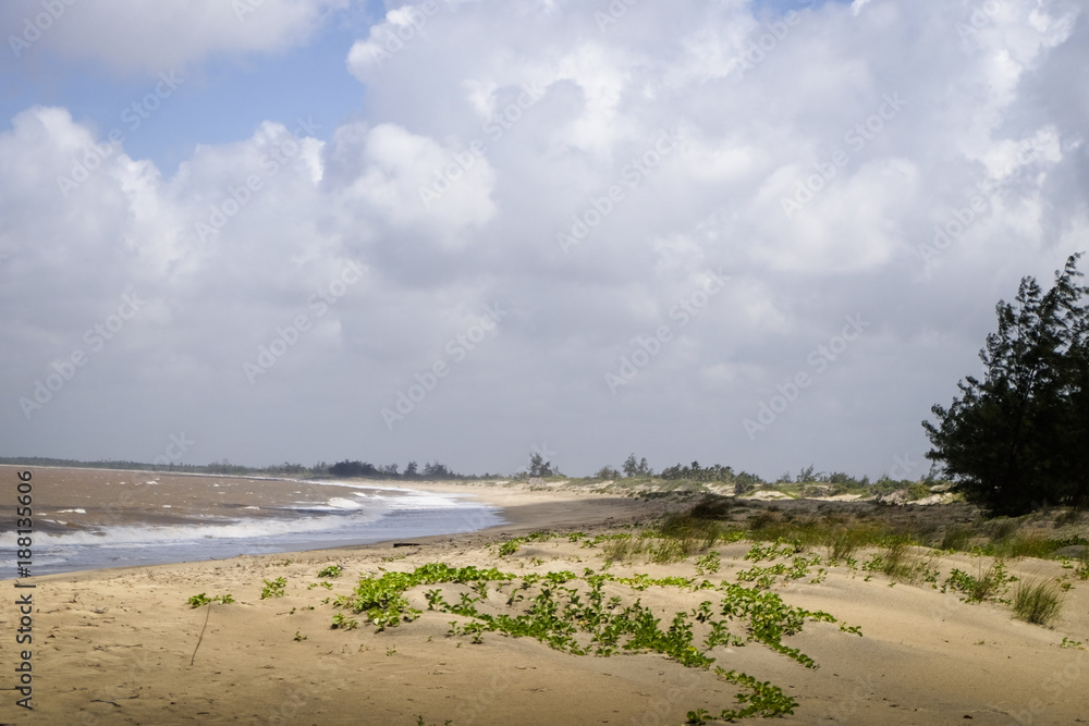 View of the coast in Kenya with clouds and blue sky.