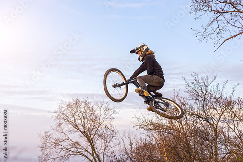 Professional rider is jumping on the bicycle, extreme sport.