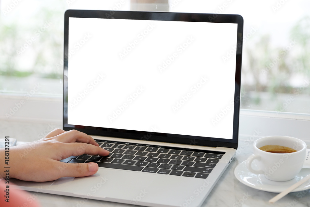 Man hands typing laptop computer with blank screen for mock up template background, business technology and lifestyle background concept Man hands typing laptop computer with blank screen for mock up template background, business technology and lifestyle background concept