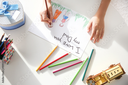 Little boy drawing greeting...