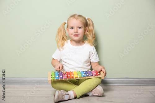 Cute little girl playing wi...