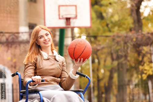 Young woman in wheelchair w...