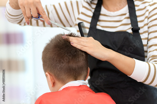 Female hairdresser working ...