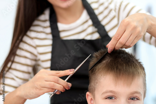Female hairdresser working ...