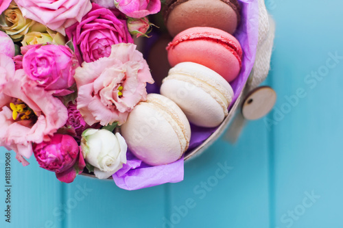 Perfect present  flower composition with macaroons in craft box