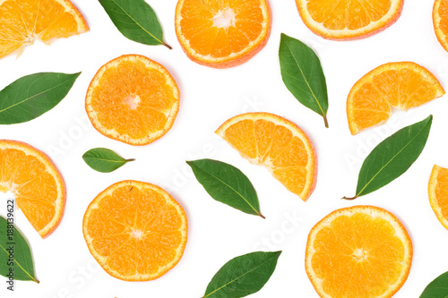 Slices of orange or tangerine with leaves isolated on white background. Flat lay, top view. Fruit composition