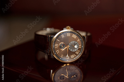 Men's watch, close-up golden hand watch. Best accessories for man