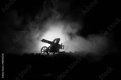 War Concept. Military silhouettes fighting scene on war fog sky background, World War Soldiers Silhouettes Below Cloudy Skyline At night. Attack scene.