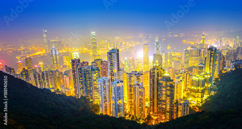 Hong Kong at night. View of Victoria Harbour and Hong Kong Central beside Victoria Peak. Taken from Victoria Peak (Taiping Mountain). Located in Hong Kong.
