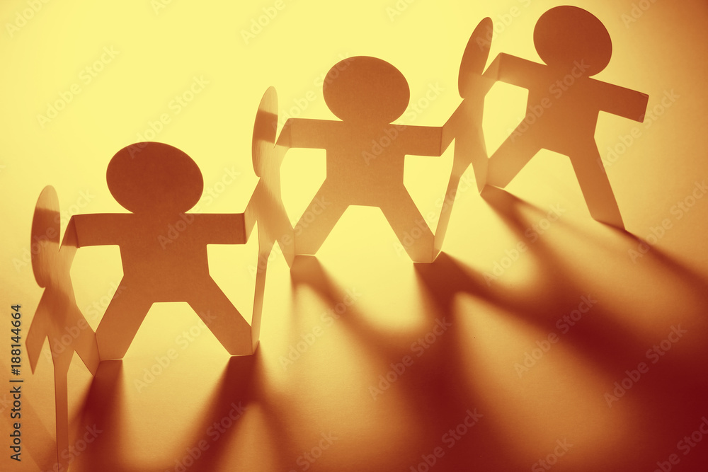 Paper chain team holding hands Paper chain team holding hands