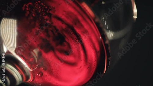 Pouring Cold champagne into glass. Slow motion. Close up view photo