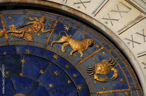 Ancient time, Horoscope and Astrology. Detail of Saint Mark Square renaissance Clock Tower in Venice with zodiac signs Leo, Cancer, Virgo, planet and stars (15th century)