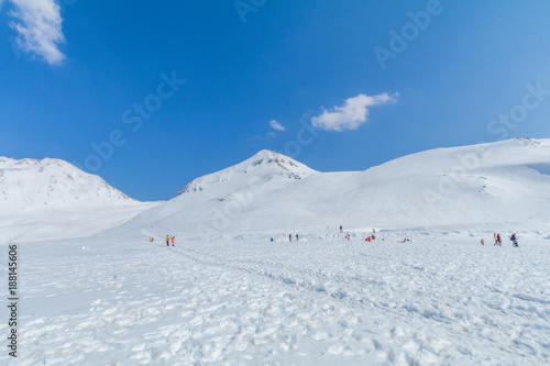  The snow mountains of Tateyama Kurobe alpine with blue sky background is one of the most important and popular natural place in Toyama Prefecture, Japan.