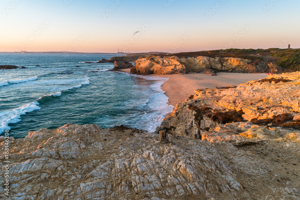 Sunset in beach with rocks in Porto Covo in Alentejo, Portugal