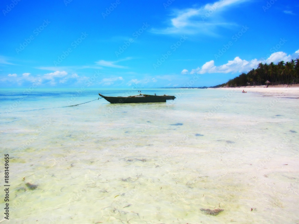 Wooden fishing boat on the shore in Zanzibar