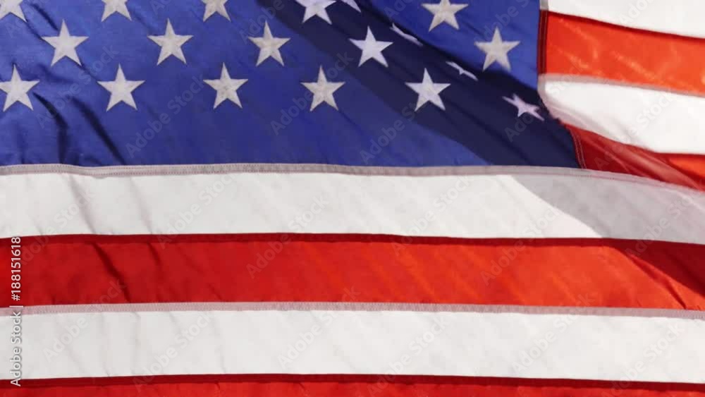 American flag symbol of the United States of America, blowing in high wind. Full screen background clip 4k UHD American flag symbol of the United States of America, blowing in high wind. Full screen background clip 4k UHD