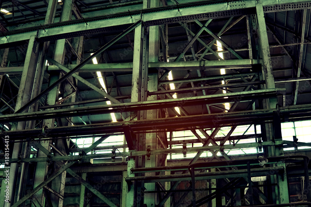 Inside of old abandon factory. A structure interior of empty industry warehouse. An abandon old factory with no equipment and machine. Image of rustic factory room structure made from iron and steel.