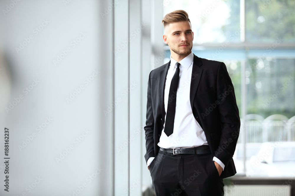 Portrait of a businessman looking at the window. Portrait of a businessman looking at the window.